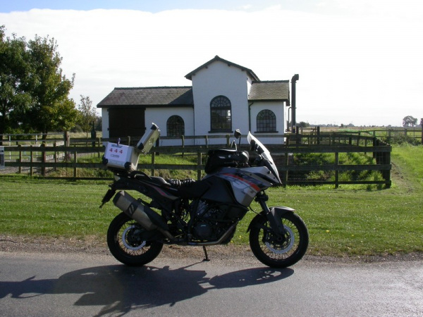 Zoom in Steve's KTM 1190 Adventure at the Jolly Fisherman Statue at the Gayton Engine Pumping Station